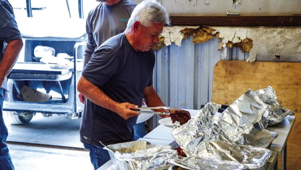 Mike Bontempo enjoys ribeye steaks and condiments purchased from Stewart’s Food Store for the CEMCO 50th anniversary celebration. Photo by Will Sadler