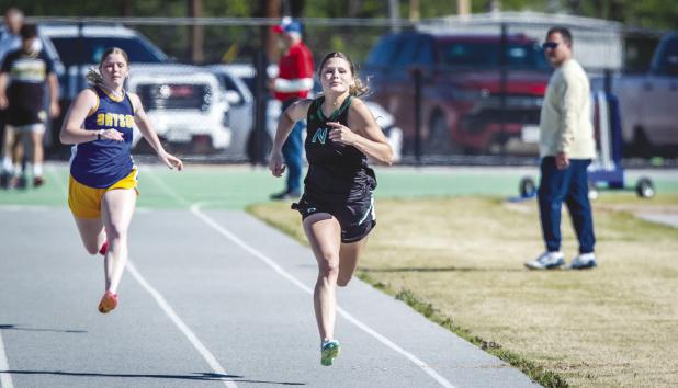 NHS Ladycat Camren Mallory moves on to Regionals in 100m and 200m dash. Photo by Will Sadler