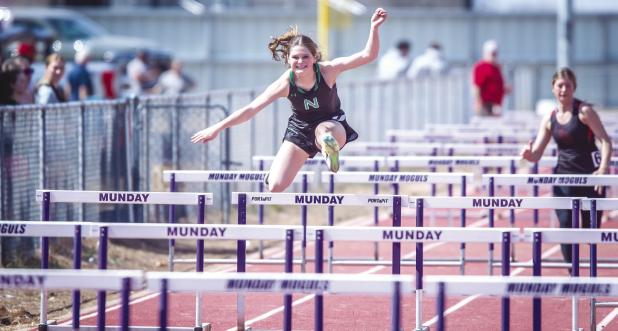 NHS Camren Mallory captures third place in 100m hurdles and second place in 200m. Photo by Will Sadler
