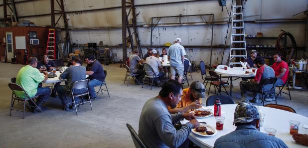 (LEFT): CEMCO employees shared an afternoon meal and fellowship on July 17, 2025, to mark the company’s 50th anniversary in Olney. The company, and guests, dined inside one of the manufacturing buildings. Photo by Will Sadler