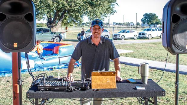 DJ Eric Loggins was on site at the National Night Out to drop some sweet beats to make the event a fun night. Photo by Will Sadler