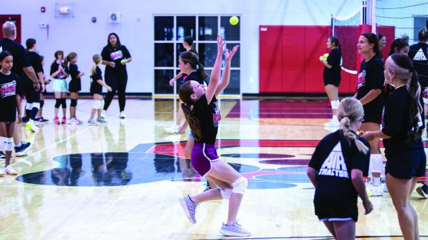 Little campers scrambled to catch tennis balls and improve their volleyball skills. Photo by Will Sadler