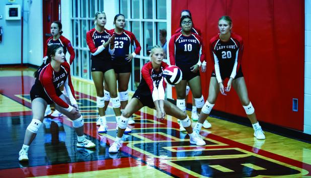 Varsity Lady Cubs warm up before the Lady Rabbits scrimmage. Photo by Will Sadler