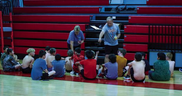 Coach Symank incentivized players by awarding tokens for achieving certain tasks or answering trivia questions correctly. Photo by Will Sadler