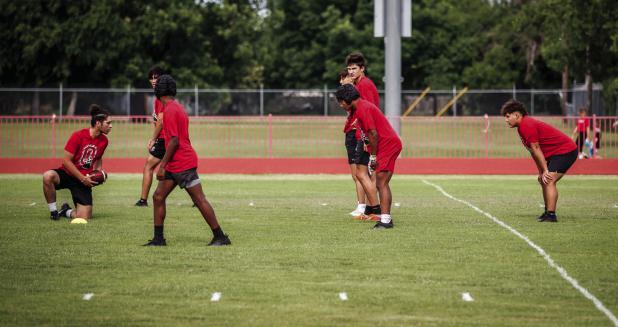 Olney Varsity Cubs Football players line up to run a play against the Munday Varsity during a recent 7-on-7 touch football game. Photo by Will Sadler