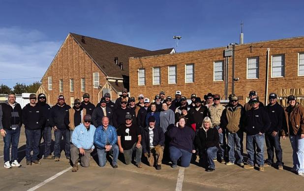 Volunteers from the First Baptist Church of Olney and Texas-New Mexico Power gathered at the church to hand out Thanksgiving meals on Nov. 10. Photo by Chad Edgington