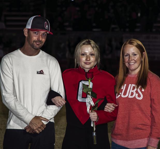 Maci McCarson. Escorted By: Krissa and Bear Glaze. Activities: POOHS - 3 years, basketball - 3 years, softball - 1 year, 4H Stock Show - 4 years showing swine.