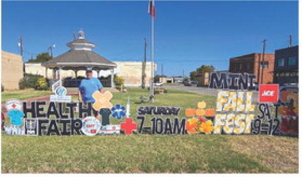 Spencer Key and his signs have become a staple on Main Street and in yards across Olney, letting the community know about milestones and goings-on. Photo by Will Sadler