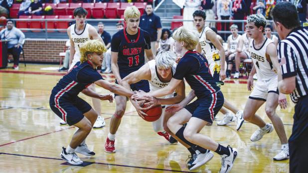 OHS Cubs defenders fight for the ball. The Cubs played with heart, grit, and speed every second of the night. Photo by Will Sadler
