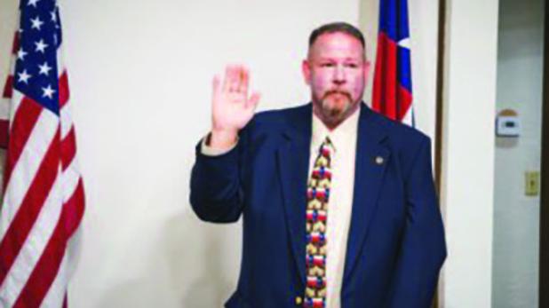 Olney’s new police chief, Bryan Barrett, took his oath of office before the Olney City Council at its Nov. 24 meeting. Photo by Will Sadler