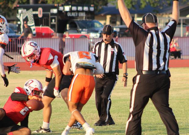 A whole pack of Cubs takes down a Petrolia ball carrier during the first half of the game. Photo by Kailyn Altmiller