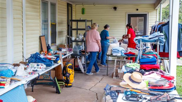 Quilts, clothes, and many useful household items were on sale at this medium-size yard sale.