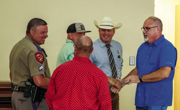 Chief Dan Birbeck speaks with law enforcement peers during his going away luncheon. Photo by Will Sadler