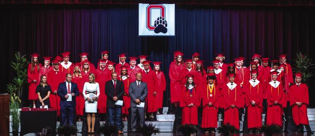The 42 members of the Olney High School Class of 2026 crossed the stage at the OHS auditorium on Friday, May 15 to claim their diplomas after a week of traditions marking the event. The class is joined by (at left) OHS Principal Haylee Haralson, OISD Supe