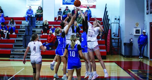 Lady Cubs #20 Natalie Simmons and #24 Angel Turner battle Lady Panther defenders under the bucket. Photo by Will Sadler