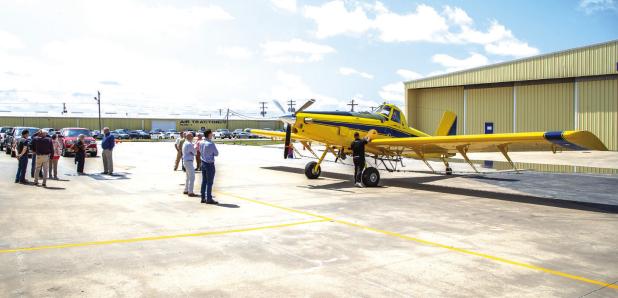 Attendees at Air Tractor’s celebration view its 5,000th aircraft on the tarmac at its Olney plant on May 28. Photo by Will Sadler