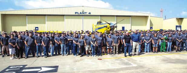 Air Tractor employees and management mark the delivery of the company’s 5,000th aircraft to Brazilian aerial application operator Dorilino Prediger, whose representatives came to Olney on May 28 to take possession of the ag plane. The company held a cel