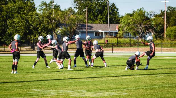 The Bobcats begin practice with special teams working in plenty of kickoffs and extra point kicking. Kicking should be automatic once the ball is hiked and plenty of repetition helps to ensure smooth kicks. Photo by Will Sadler