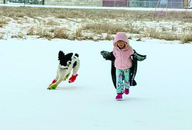 Right: Ainsley with her dog Juni