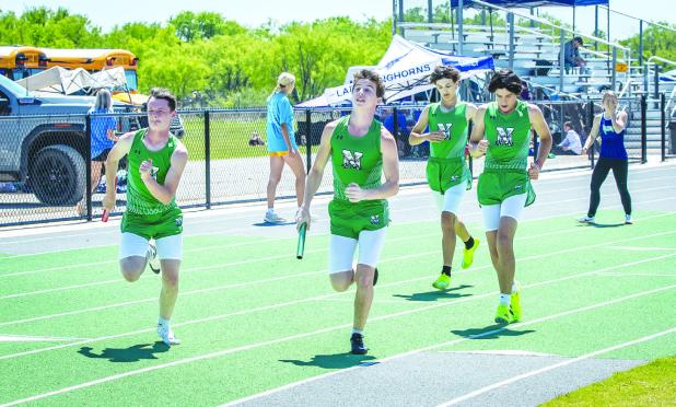 NHS Track Coal Mine Relays Bobcats warm up and practice before starting the 4x4 at the Coal Mine Relays. Photo by Will Sadler