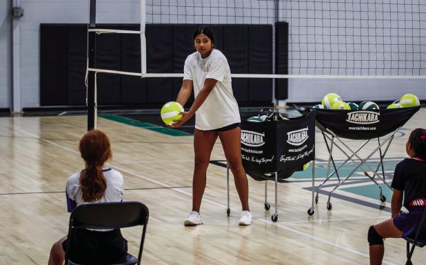 Mya Cabrera gives instruction to attendees over her summer volleyball skills session. Photos by Will Sadler