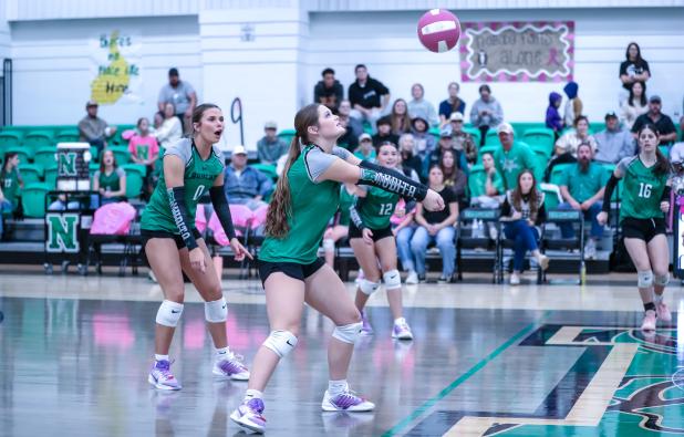 NHS Senior Ladycat #1 Camren Mallory stops a kill shot during their district match against Garner.