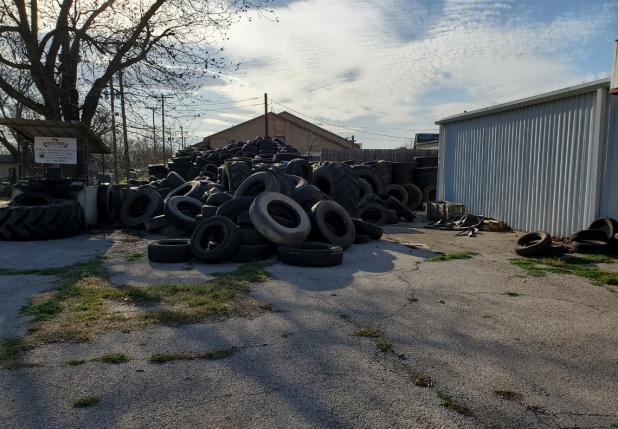 Gas station tire clean-up waits on tire cutter