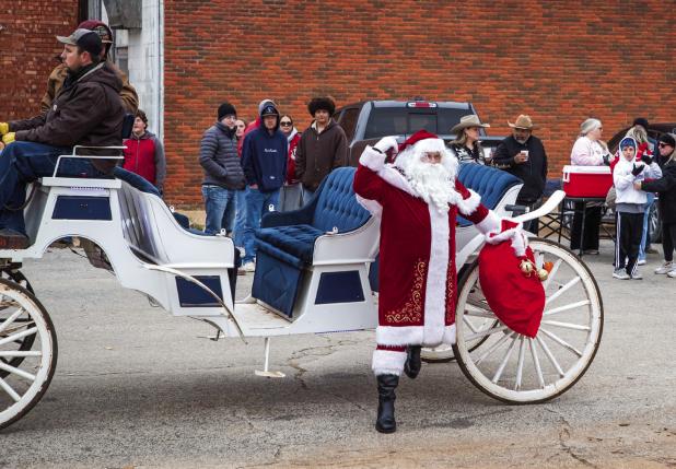 Santa was checking his list twice, seeing who was naughty and nice. Santa was the main attraction for this year’s annual tree lighting ceremony. Photo by Will Sadler