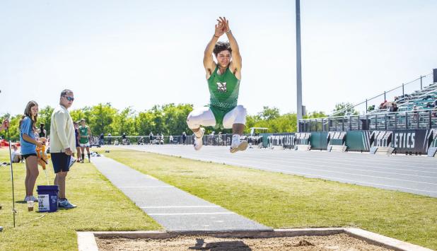 NHS Bobcat Keyton Newland moves on to Regionals in 200m Dash and Long Jump. Photo by Will Sadler