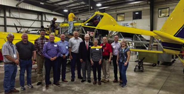 Congressman Roger Williams (in suit and tie, center) met with executives at Air Tractor and Olney leaders on Aug. 25 for a tour of the world’s largest turboprop maker and a town hall with its employees. Photo provided by Office of Rep. Roger Williams