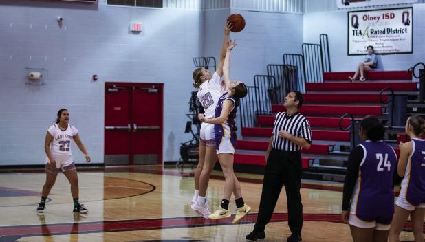 OHS Lady Cub #20 Natalie Simmons tips off against the Lady Buckaroos. Photo by Will Sadler