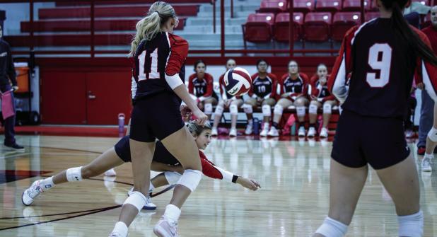 Senior and veteran Lady Cub #3-Bradi Bowers dives to the boards on a dig during the Lady Trojan District matchup. Photo by Will Sadler