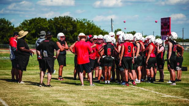 Olney ISD Athletic Director and Head Cub Football Coach Dustin Altmiller instructs Cubs during football practice. Photo by Will Sadler
