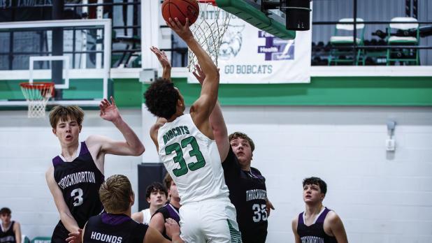 Bobcat #33 Jacob Omundi was in beast mode under the basket, dominating defenders under the bucket during the Greyhound matchup. Photo by Will Sadler