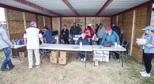 Friends, family and community members volunteer each year to make sure the Steven Harvey Fund Raiser is a complete success. Photo by Will Sadler