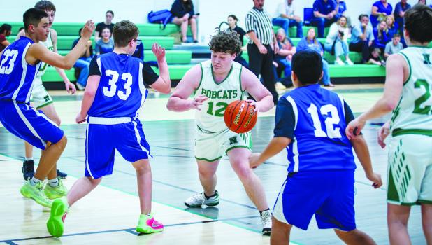 NJH Bobcat #12 Braxton Dobbs breaks for the bucket in heavy Longhorn traffic. Photo by Will Sadler