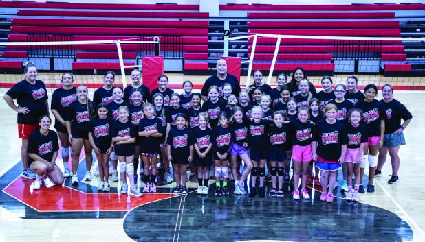 Coach Tarr’s volleyball summer camp was a huge success, with a packed gym of laughing, squeaky sneakers and girls flying all over the gym learning new skills. Photo by Will Sadler