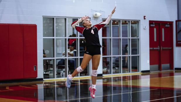 Lady Cub #4 Taylor Cadotte sends a volley to rival Quanah Lady Indians. The Lady Cubs came away with a win in the series, 2-0. Photo by Will Sadler