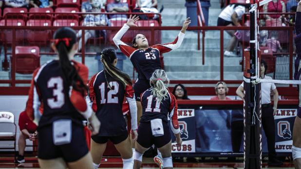 Lady Cub #23 Aubree Englishbee goes up for a slam during the battle with rival Perrin-Whitt. | Photo by Will Sadler