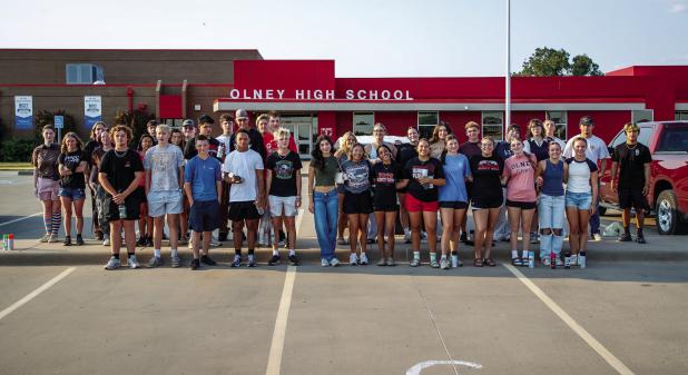 OHS Seniors pose for a photo before painting the street in front of the high school. Left to right: Cheyanne Burger, Makayla Strawbridge, Blaize DeVries, Kaydence Tackett, Case Gray, Ariel Herrera, Benjamin Baran, Ryder Lisle, Alyvia Vega, Josh Hart, Bray
