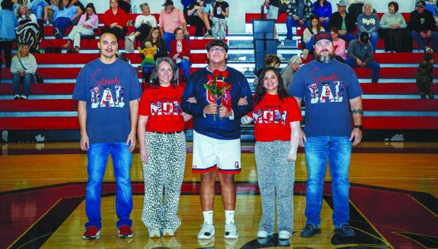OHS Senior Cub #24 Peyton Bedford was escorted by [L-R] Alex Bedford, Ashley Bedford, Marissa Sandlin and Jeremiah Sandlin. Favorite memory: anytime he gets to step on the court with his best buds. Advice for younger players: enjoy the time you have and p