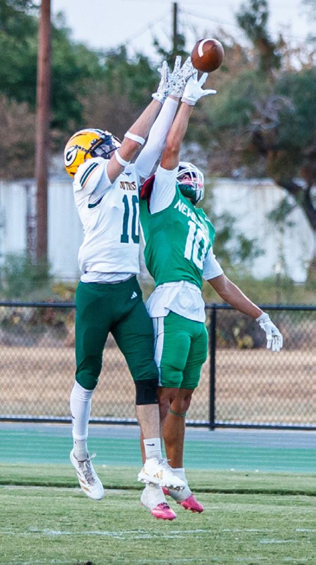 Bobcat defender #10 Keegen Voyles, RB/WR, goes shoulder to shoulder with his Guthrie offensive counterpart and comes away with the interception.