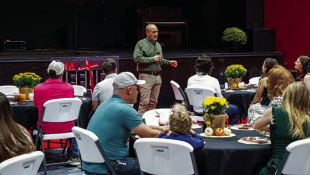 Olney Junior High School Principal and board member Ed Berngen talks about the many contributions The Refuge Christian Community Center has made to the community, churches, and the school district during its 10th anniversary celebration. Photo by Will Sad