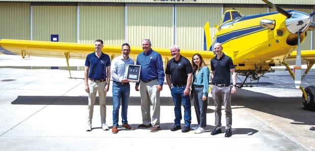 Representatives from Pratt &amp; Whitney Canada award Air Tractor President Jim Hirsch and Thrush Aircraft President Mark McDonald, president and CEO of Thrush Aircraft, with a commemorative award recognizing the companies’ long-standing partnership. Ph