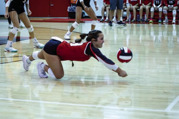 Lady Cub #19 Braelyn Casteel, shown with a dig against rival Lady Pirates, was chosen as player of the game. | Photo by Will Sadler