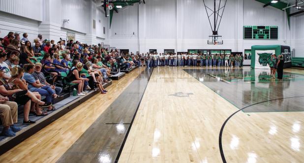 Coaches present speeches before players and the community during Meet the Bobcats night. Photo by Will Sadler