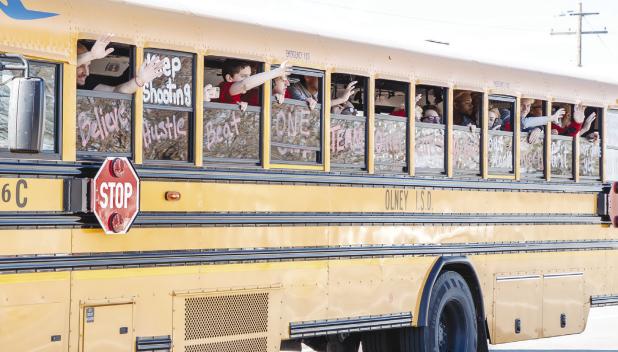 The Cubs were all smiles as they rode past cheering fans, parents, and community members who lined the highway to cheer on our Cubs. Photo by Will Sadler