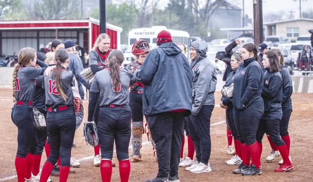 OHS Lady Cubs Coach Justin Tate gives a pep/strategy talk to the Lady Cubs. Photo by Will Sadler
