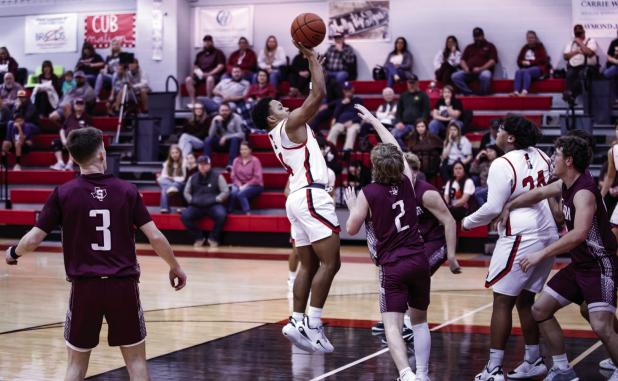 OHS Cubs #4 Jamarcus Collins put up 6 points for the Cubs with a combination of floaters and drives to the basket. Shown making a bucket inside the line with a floater. Photo by Will Sadler