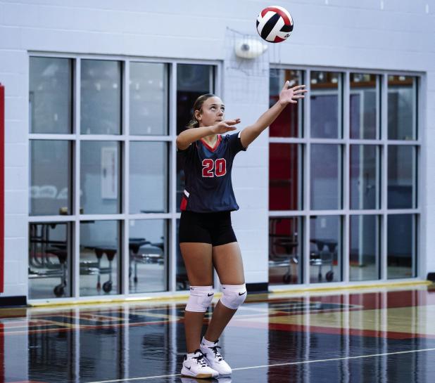 OJH Lady Cub #20 Harper Watson serves during the Lady Indian match. Photo by Will Sadler